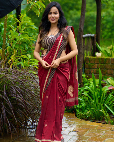 Maroon Jamdani saree elevated with zari-border