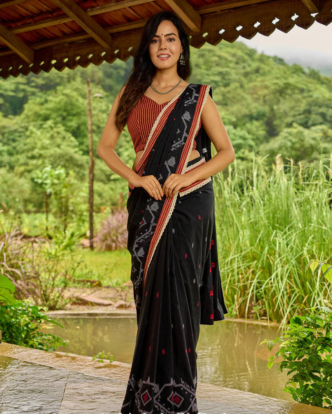 Black cotton saree blending Jamdani-inspired weaves with Ajrakh elegance
