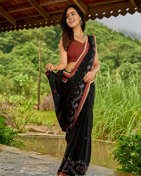 Black cotton saree blending Jamdani-inspired weaves with Ajrakh elegance