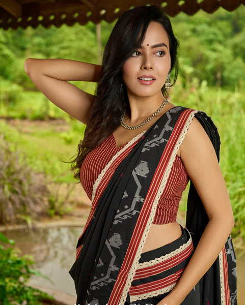 Black cotton saree blending Jamdani-inspired weaves with Ajrakh elegance