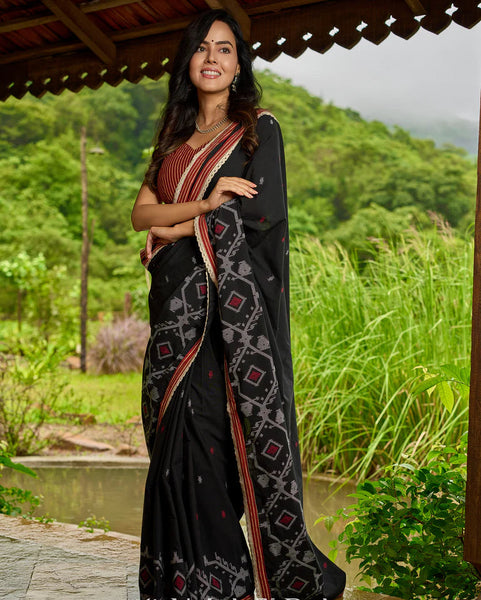 Black cotton saree blending Jamdani-inspired weaves with Ajrakh elegance