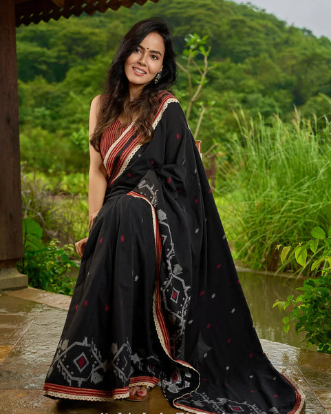 Black cotton saree blending Jamdani-inspired weaves with Ajrakh elegance
