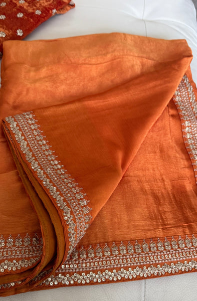 Orange Crepe Silk Saree with Zardosi Border