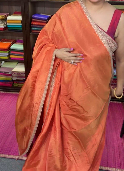 Orange Crepe Silk Saree with Zardosi Border