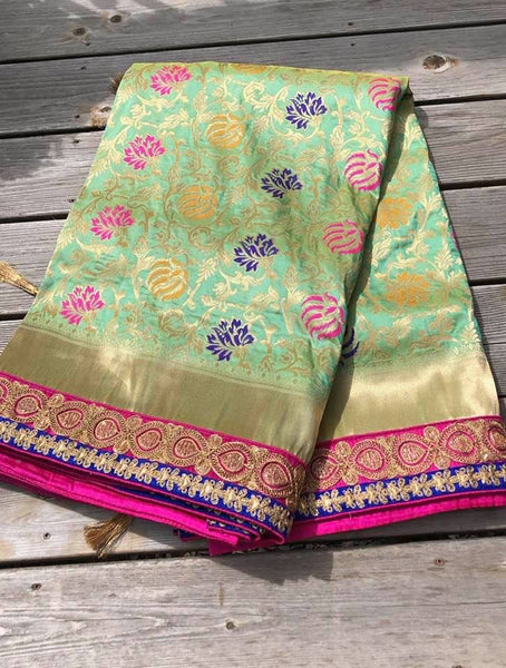 Pastel Green Pure Banarasi Brocade Silk Saree with Readymade Stitched Blouse.
