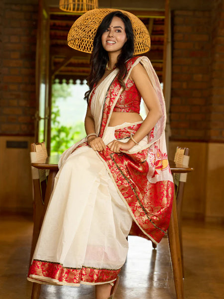 White Chanderi saree with Benarasi border featuring artisanal hand-painted floral motifs