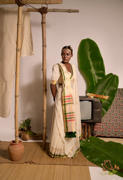 Off white handwoven mul cotton saree with green and zari border