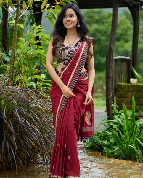 Maroon Jamdani saree elevated with zari-border