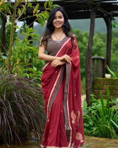 Maroon Jamdani saree elevated with zari-border