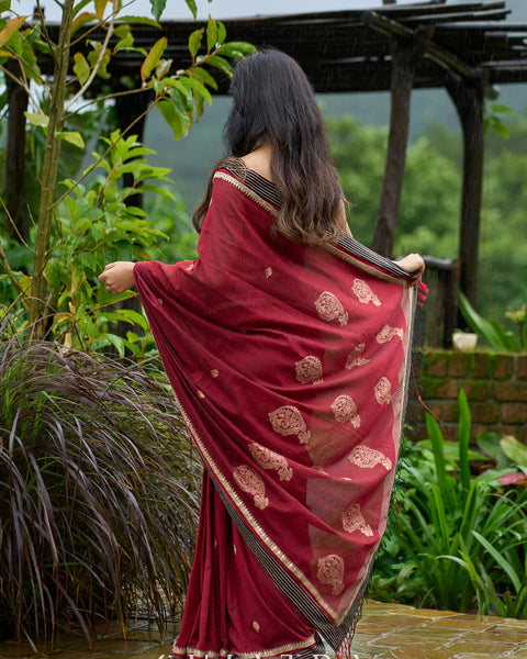Maroon Jamdani saree elevated with zari-border
