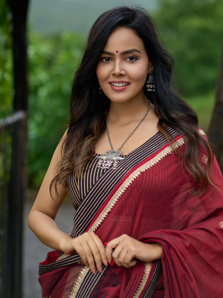 Maroon Jamdani saree elevated with zari-border