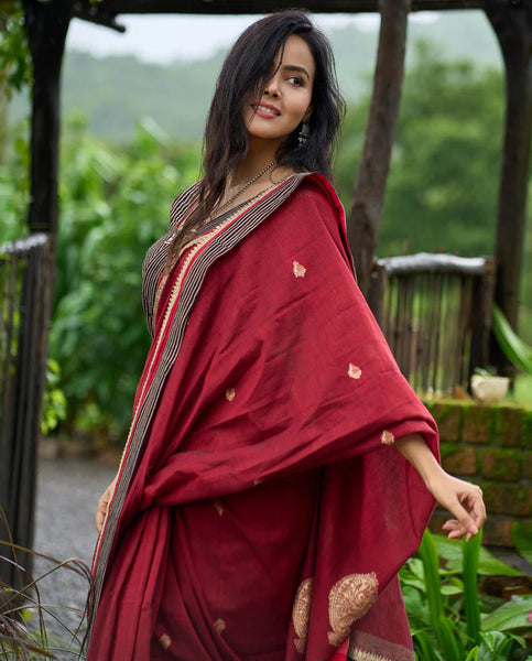 Maroon Jamdani saree elevated with zari-border