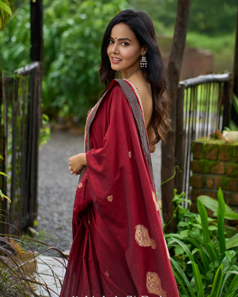Maroon Jamdani saree elevated with zari-border