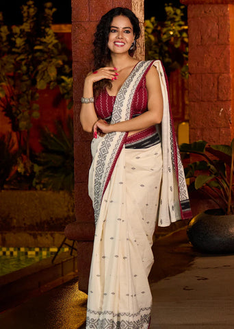 Ivory cotton saree adorned with Jamdani-inspired woven motifs