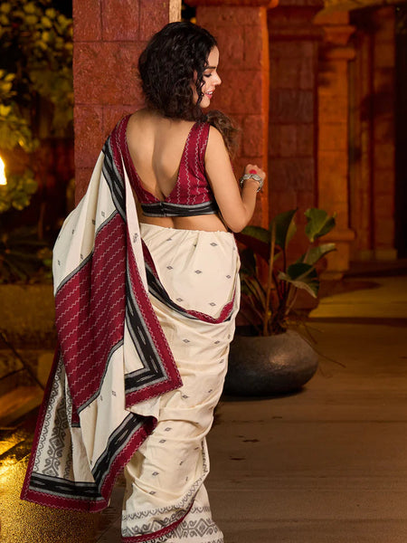 Ivory cotton saree adorned with Jamdani-inspired woven motifs