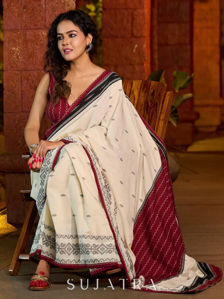 Ivory cotton saree adorned with Jamdani-inspired woven motifs
