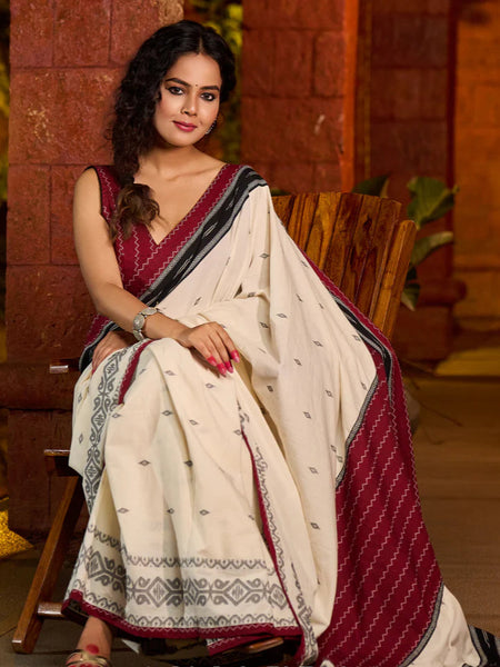 Ivory cotton saree adorned with Jamdani-inspired woven motifs