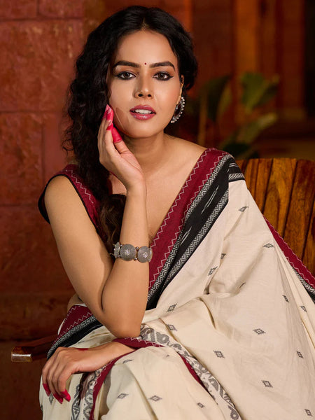 Ivory cotton saree adorned with Jamdani-inspired woven motifs