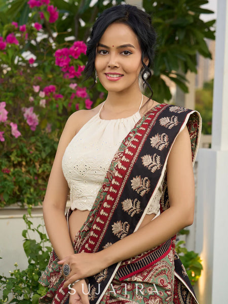Green paisley cotton saree with contrast black pallu and border