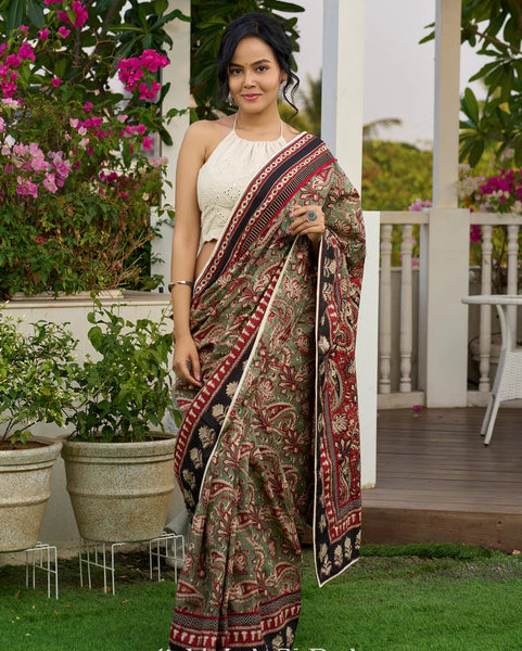Green paisley cotton saree with contrast black pallu and border