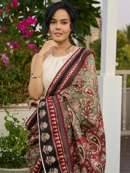 Green paisley cotton saree with contrast black pallu and border