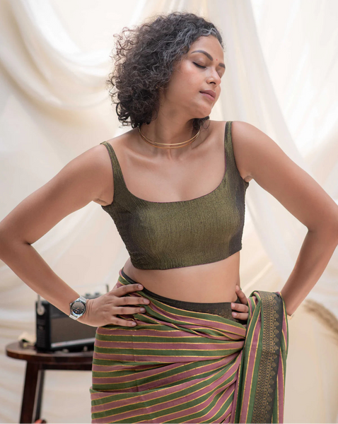 Reversible sleeveless padded U-neck blouse in pink buti and plain olive viscose with stretchable versatile blouse