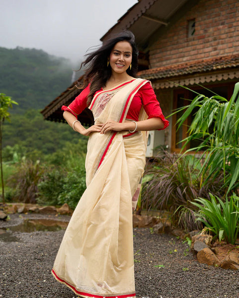Cream Chanderi saree with subtle red border, featuring hand-painted Durga art