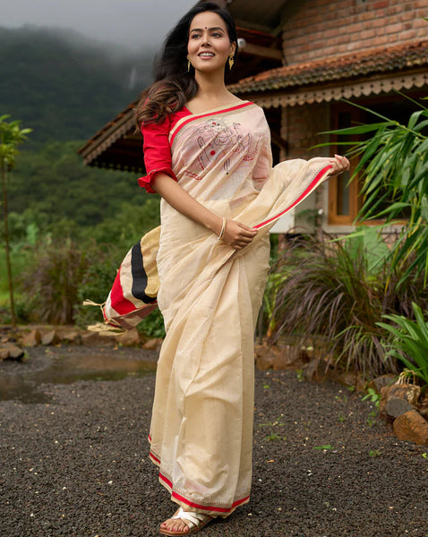 Cream Chanderi saree with subtle red border, featuring hand-painted Durga art