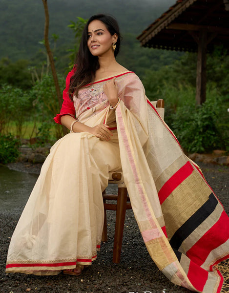 Cream Chanderi saree with subtle red border, featuring hand-painted Durga art