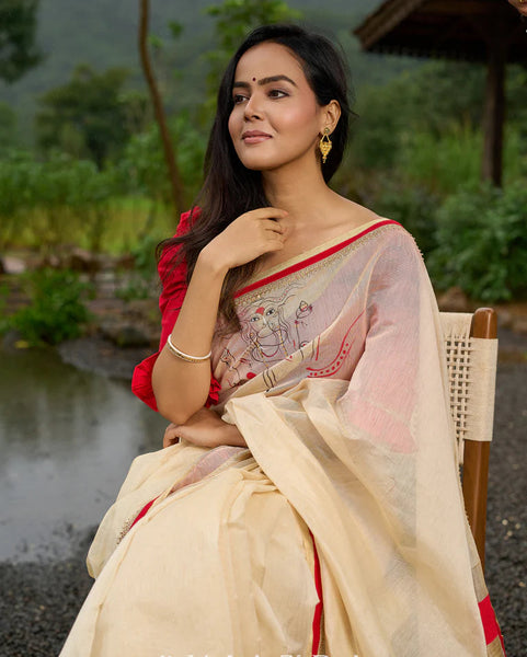 Cream Chanderi saree with subtle red border, featuring hand-painted Durga art