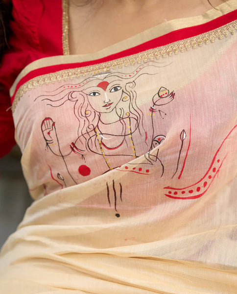 Cream Chanderi saree with subtle red border, featuring hand-painted Durga art