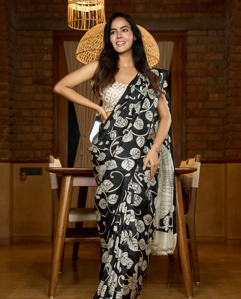 Black silk saree featuring intricate hand-drawn Kalamkari style motifs