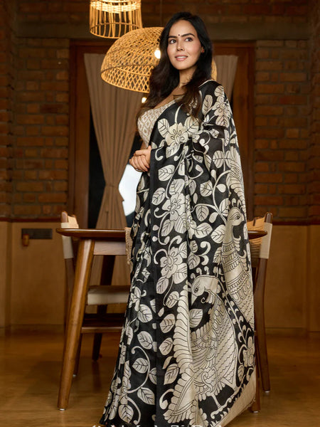Black silk saree featuring intricate hand-drawn Kalamkari style motifs
