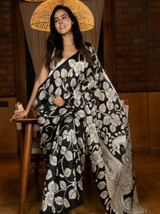 Black silk saree featuring intricate hand-drawn Kalamkari style motifs