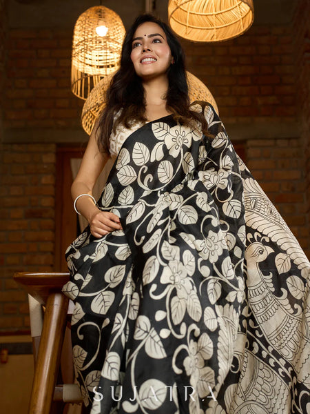 Black silk saree featuring intricate hand-drawn Kalamkari style motifs