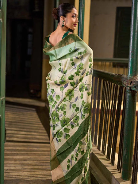 Green Tussar Silk Saree with Delicate Floral Artwork and Classic Border