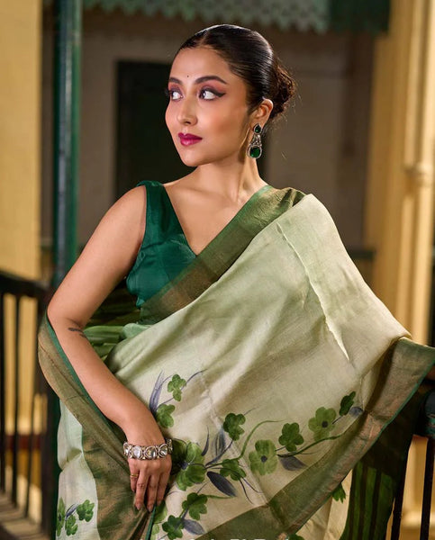 Green Tussar Silk Saree with Delicate Floral Artwork and Classic Border