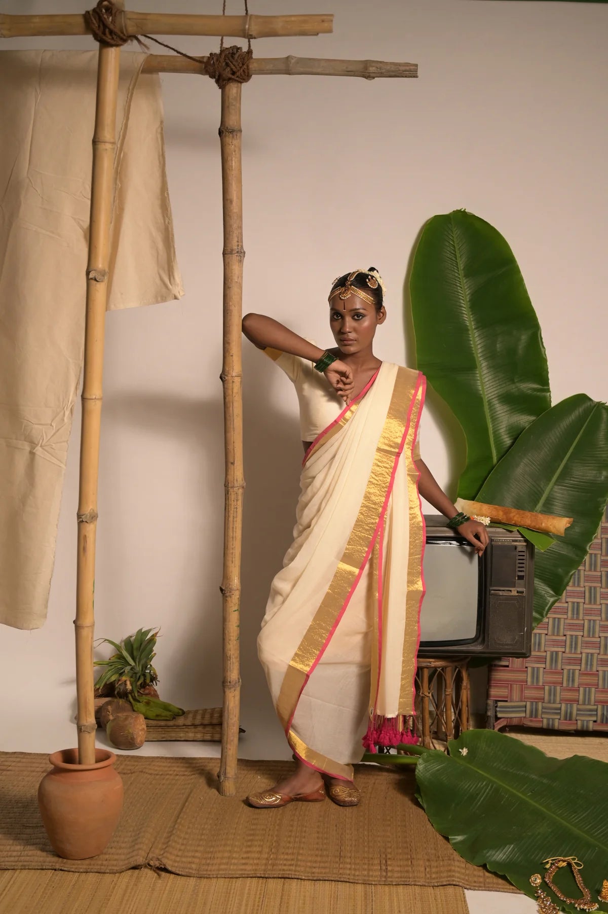 Off white mul cotton handwoven saree with golden and pink border