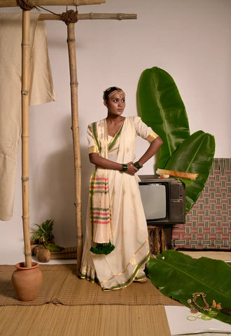 Off white handwoven mul cotton saree with green and zari border
