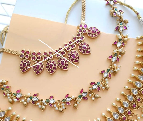 Aarvi goldplated contemporary Necklace set with Red and Green Stonework