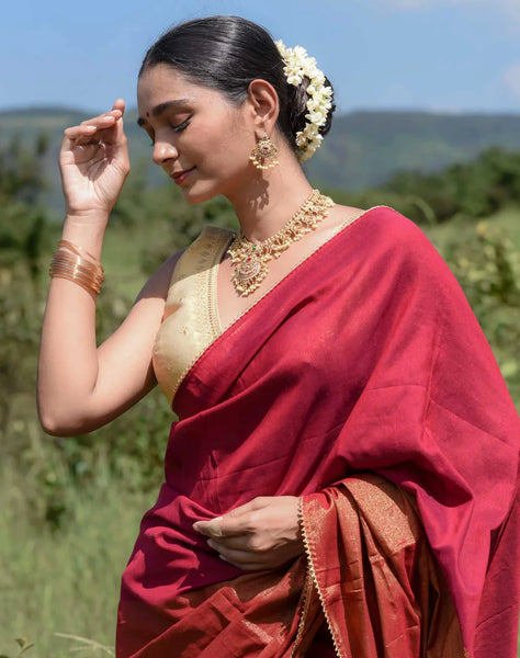 Maroon and gold half-and-half saree with Gota patti and Samosa lace