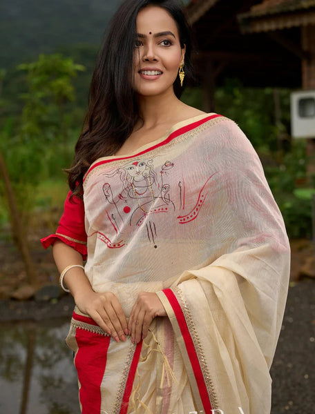 Cream Chanderi saree with subtle red border, featuring hand-painted Durga art