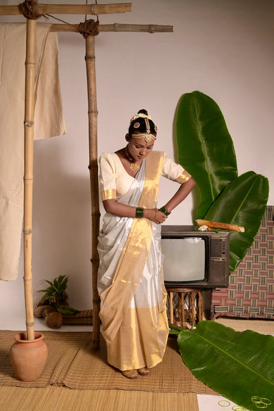 Off white mul cotton handwoven saree with golden border