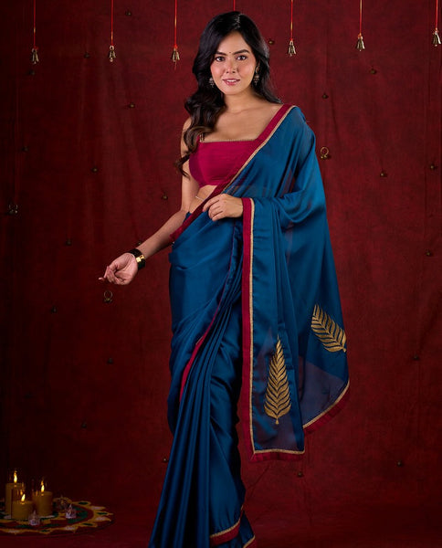 Deep Teal Silk Blend Saree Adorned with Magenta Border & Intricately Embroidered Pallu