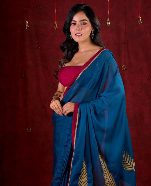 Deep Teal Silk Blend Saree Adorned with Magenta Border & Intricately Embroidered Pallu