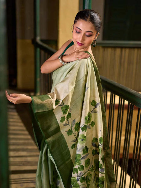 Green Tussar Silk Saree with Delicate Floral Artwork and Classic Border