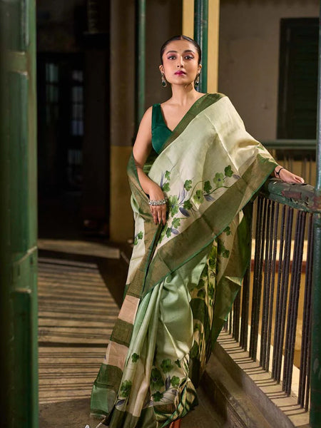 Green Tussar Silk Saree with Delicate Floral Artwork and Classic Border