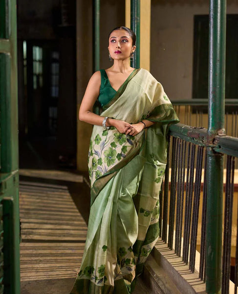 Green Tussar Silk Saree with Delicate Floral Artwork and Classic Border