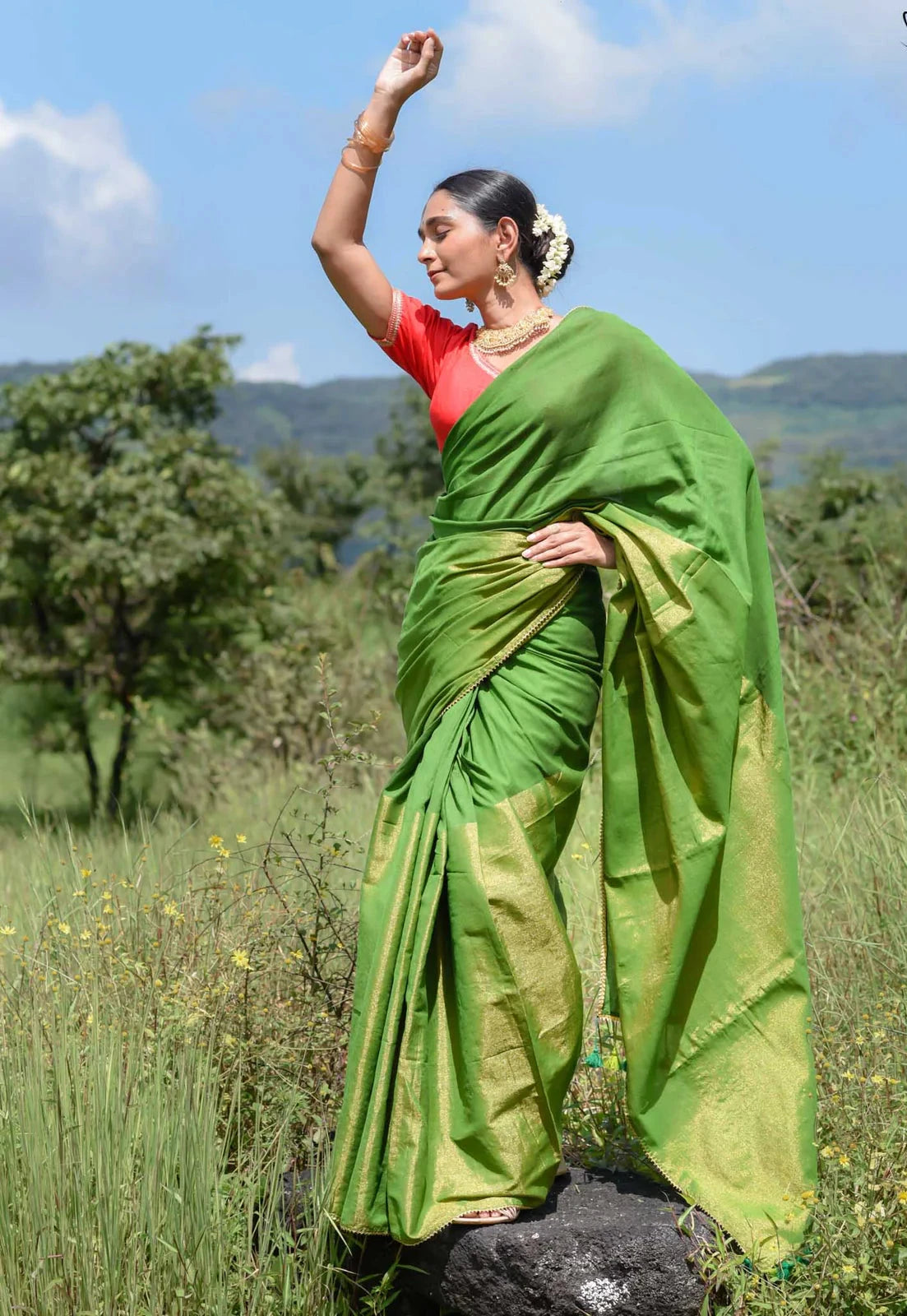 Elegant green and gold half-and-half saree with Gota patti lace