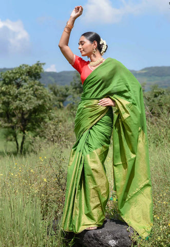 Elegant green and gold half-and-half saree with Gota patti lace